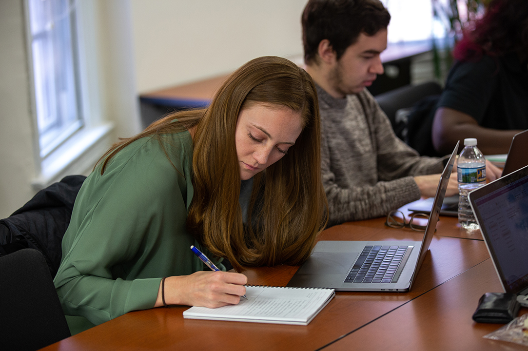 A student taking notes.